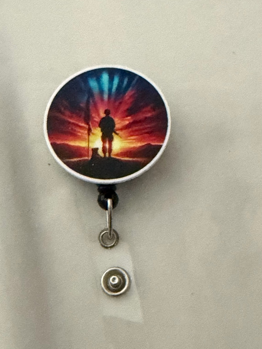 Sunset Silhouette Badge Reel - Vibrant Multicolor